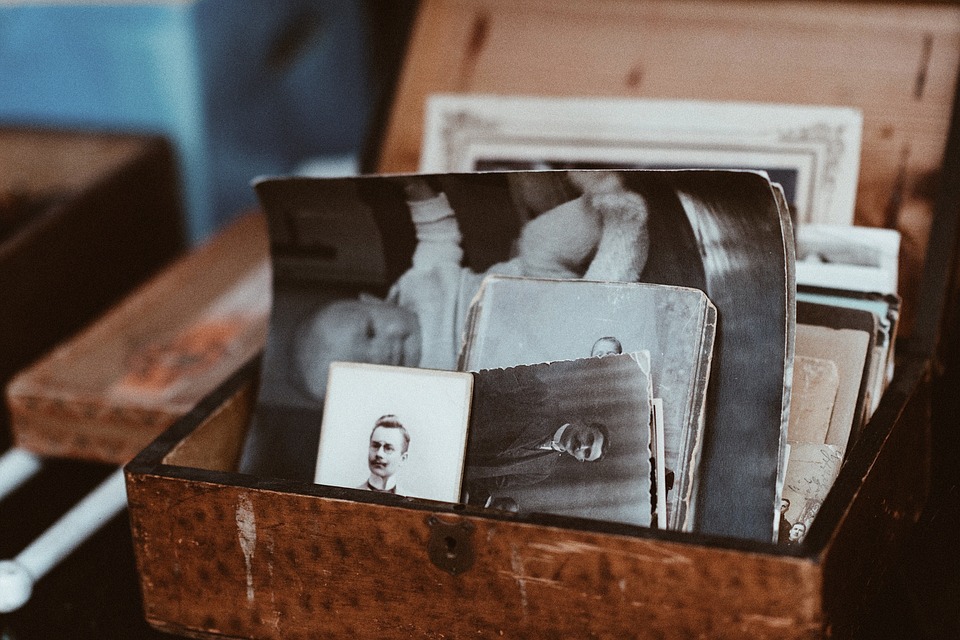 old black and white photographs in a box
