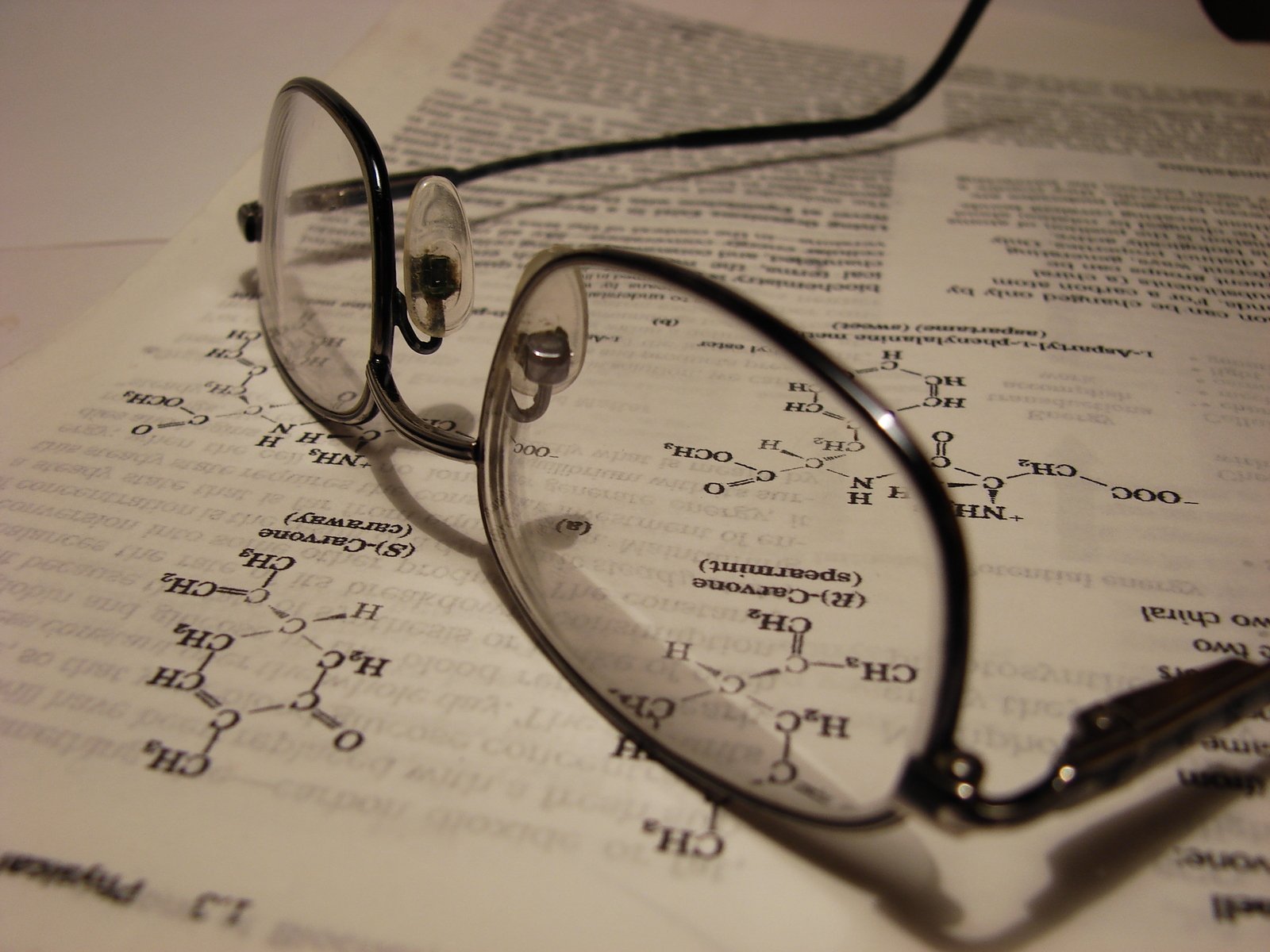 glasses on a textbook