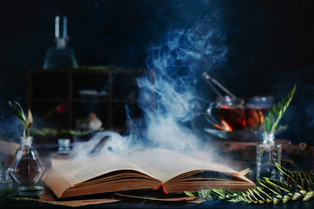 tips for writing horror - open book with spooky smoke coming off it